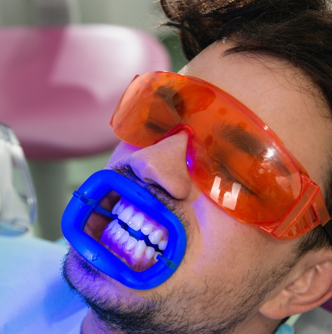 Man in middle of in office teeth whitening