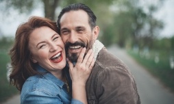 Red haired woman hugging a bearded man