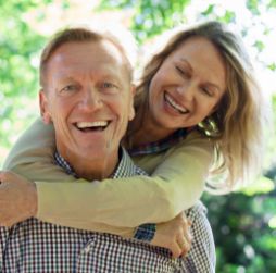 Woman hugging man from behind