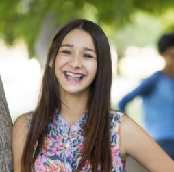 Young woman with braces smiling