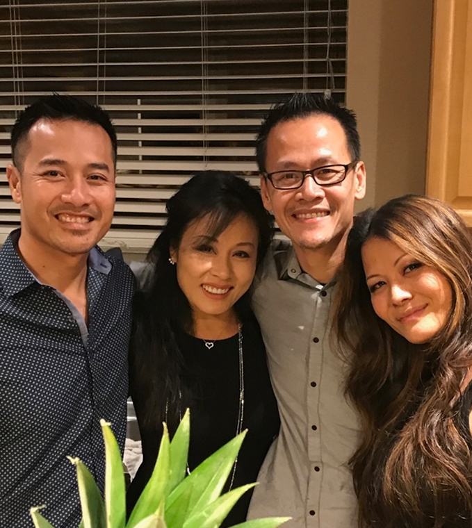 Dr Thanh and three other people smiling