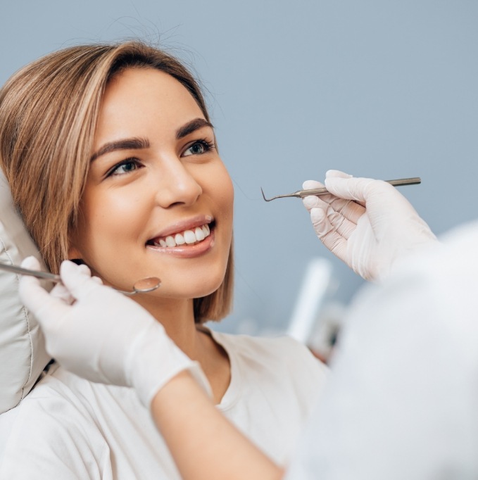 Female patient smiling at her dentist