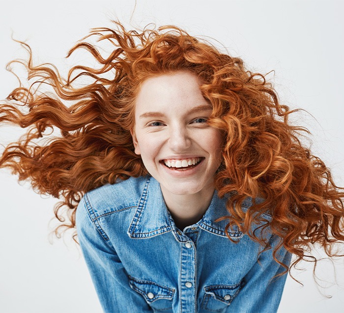 Smiling woman with red hair