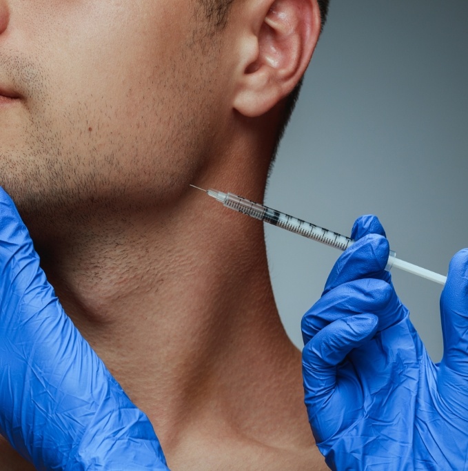 Close up of mans head during BOTOX injection